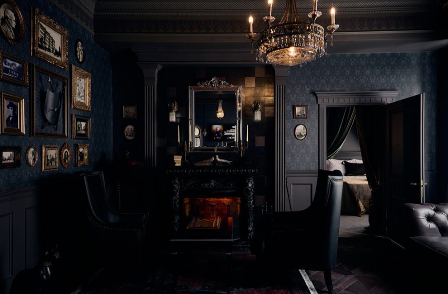 Inside the apartment — gallery wall, fireplace and a KION screen, all in 1930s aesthetic